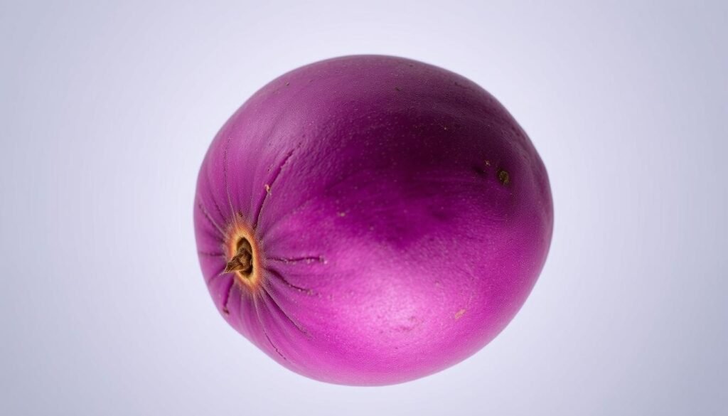 A close-up, high-resolution image of a plump, vibrant purple Japanese sweet potato (satsumaimo) against a clean, minimalist background. The potato has a smooth, glossy skin with a deep, rich purple hue, illuminated by soft, directional lighting that casts gentle shadows, highlighting its unique texture and form. The image has a warm, earthy tone, conveying the inherent sweetness and nutritional value of this traditional Japanese ingredient. The composition is balanced and visually striking, showcasing the potato's distinctive color and shape in a simple, elegant manner.